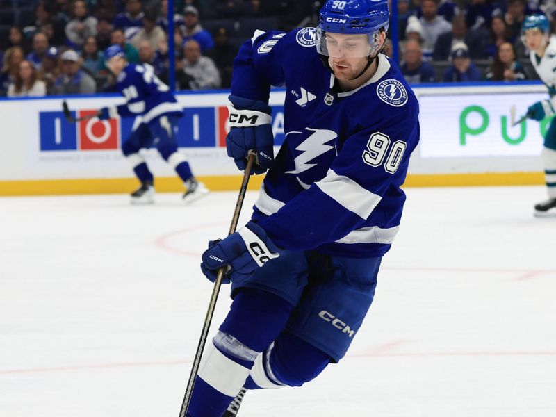 Jan 20, 2026; Tampa, Florida, USA; Tampa Bay Lightning defenseman J.J. Moser (90) skates with the puck against the San Jose Sharks during the second period at Benchmark International Arena. Mandatory Credit: Kim Klement Neitzel-Imagn Images