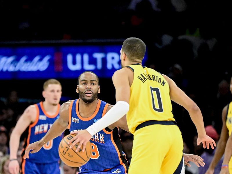 NEW YORK, NEW YORK - FEBRUARY 10:  Alec Burks #18 of the New York Knicks defends Tyrese Haliburton #0 of the Indiana Pacers during the second half at Madison Square Garden on February 10, 2024 in New York City. NOTE TO USER: User expressly acknowledges and agrees that, by downloading and or using this photograph, User is consenting to the terms and conditions of the Getty Images License Agreement. (Photo by Steven Ryan/Getty Images)