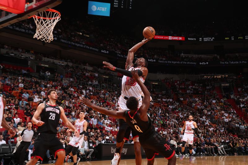 MIAMI, FL - FEBRUARY 10: Bam Adebayo #13 of the Miami Heat shoots the ball during the game against the Houston Rockets on February 10, 2023 at FTX Arena in Miami, Florida. NOTE TO USER: User expressly acknowledges and agrees that, by downloading and or using this Photograph, user is consenting to the terms and conditions of the Getty Images License Agreement. Mandatory Copyright Notice: Copyright 2023 NBAE (Photo by Issac Baldizon/NBAE via Getty Images)