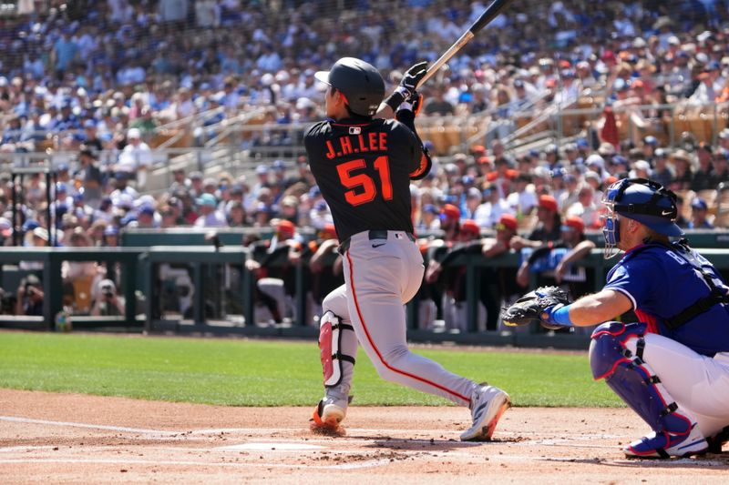 Mar 1, 2025; Phoenix, Arizona, USA; San Francisco Giants outfielder Jung Hoo Lee (51) hits against the Los Angeles Dodgers during the first inning at Camelback Ranch-Glendale. Mandatory Credit: Joe Camporeale-Imagn Images
