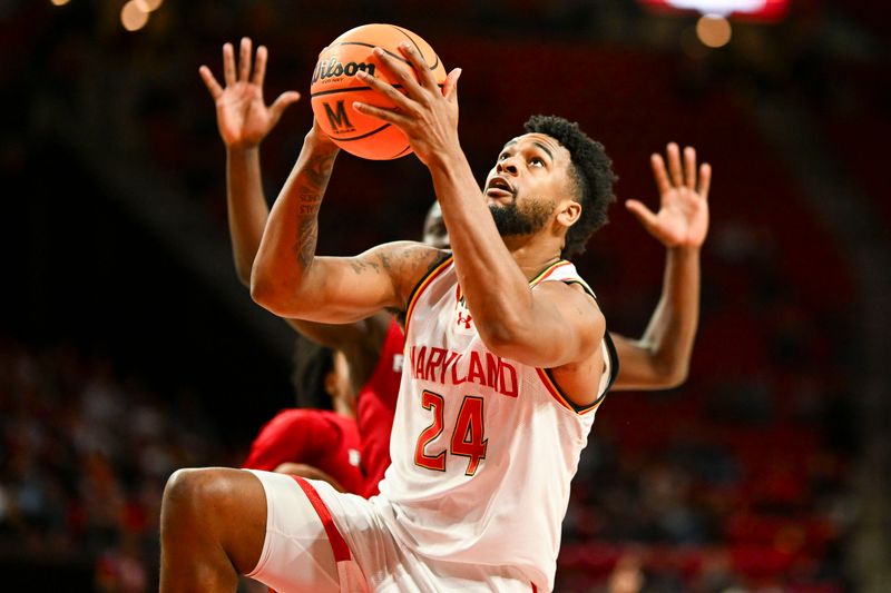 Feb 6, 2024; College Park, Maryland, USA; Maryland Terrapins forward Donta Scott (24) shoots a lay up during the second half  against the Rutgers Scarlet Knights at Xfinity Center. Mandatory Credit: Tommy Gilligan-USA TODAY Sports