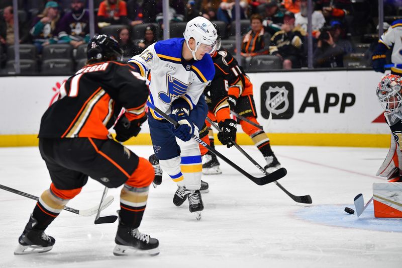 Apr 7, 2024; Anaheim, California, USA; St. Louis Blues right wing Alexey Toropchenko (13) moves in for a shot against the Anaheim Ducks during the first period at Honda Center. Mandatory Credit: Gary A. Vasquez-USA TODAY Sports