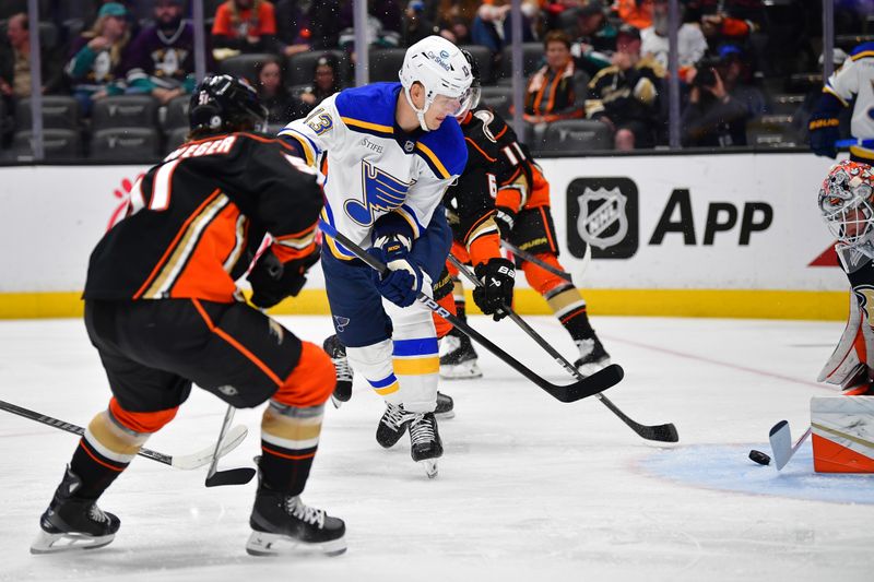 Apr 7, 2024; Anaheim, California, USA; St. Louis Blues right wing Alexey Toropchenko (13) moves in for a shot against the Anaheim Ducks during the first period at Honda Center. Mandatory Credit: Gary A. Vasquez-USA TODAY Sports