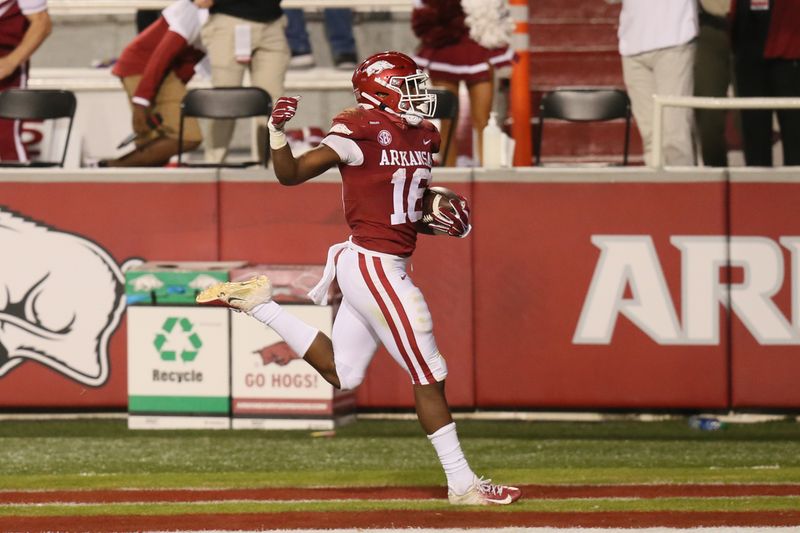 Nov 7, 2020; Fayetteville, Arkansas, USA; Arkansas Razorbacks wide receiver Treylon Burks (16) scores a touchdown against the Tennessee Volunteers at Donald W. Reynolds Razorback Stadium. Arkansas won 24-13. Mandatory Credit: Nelson Chenault-USA TODAY Sports