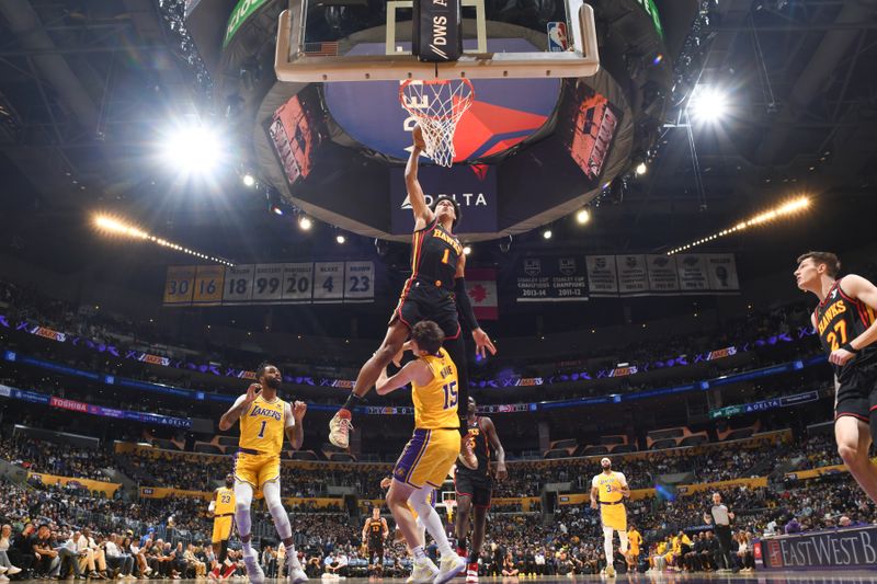 LOS ANGELES, CA - MARCH 18:  Jalen Johnson #1 of the Atlanta Hawks slam dunk during the game  on March 18, 2024 at Crypto.Com Arena in Los Angeles, California. NOTE TO USER: User expressly acknowledges and agrees that, by downloading and/or using this Photograph, user is consenting to the terms and conditions of the Getty Images License Agreement. Mandatory Copyright Notice: Copyright 2024 NBAE (Photo by Adam Pantozzi/NBAE via Getty Images)