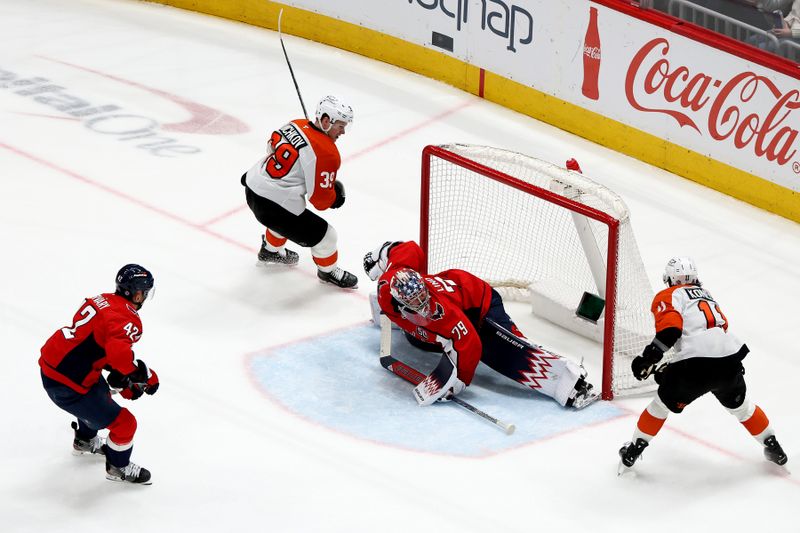 Mar 20, 2025; Washington, District of Columbia, USA; Washington Capitals goaltender Charlie Lindgren (79) makes a save on a shot attempt made by Philadelphia Flyers right wing Travis Konecny (11) during the third period at Capital One Arena. Mandatory Credit: Daniel Kucin Jr.-Imagn Images