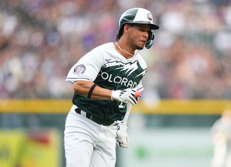 Aug 19, 2023; Denver, Colorado, USA; Colorado Rockies shortstop Ezequiel Tovar (14) heads home to score a run in the first inning against the Chicago White Sox at Coors Field. Mandatory Credit: Ron Chenoy-USA TODAY Sports