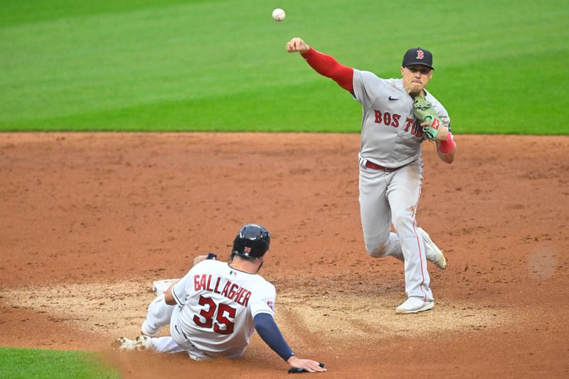 Jun 8, 2023; Cleveland, Ohio, USA; Boston Red Sox shortstop Enrique Hernandez (5) throws to first base after forcing out Cleveland Guardians catcher Cam Gallagher (35) in the third inning at Progressive Field. Mandatory Credit: David Richard-USA TODAY Sports