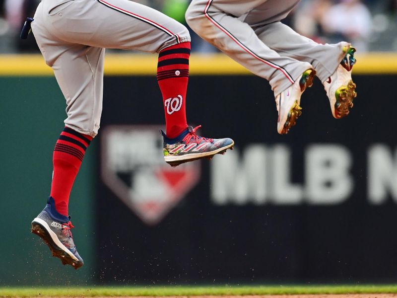 Jun 2, 2024; Cleveland, Ohio, USA; Washington Nationals right fielder Eddie Rosario (8) celebrates second baseman Luis Garcia Jr. (2) after the Nationals beat the Cleveland Guardians at Progressive Field. Mandatory Credit: Ken Blaze-USA TODAY Sports