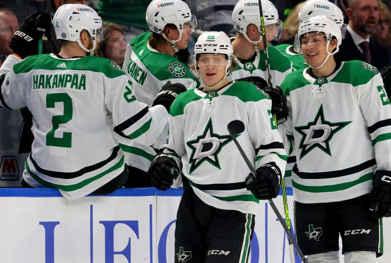 Mar 9, 2023; Buffalo, New York, USA;  Dallas Stars left wing Joel Kiviranta (25) celebrates his goal with teammates during the second period against the Buffalo Sabres at KeyBank Center. Mandatory Credit: Timothy T. Ludwig-USA TODAY Sports