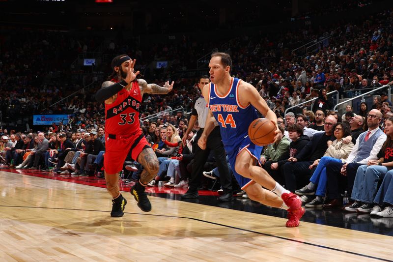 TORONTO, CANADA - MARCH 27: Bojan Bogdanovic #44 of the New York Knicks dribbles the ball during the game against the Toronto Raptors on March 27, 2024 at the Scotiabank Arena in Toronto, Ontario, Canada.  NOTE TO USER: User expressly acknowledges and agrees that, by downloading and or using this Photograph, user is consenting to the terms and conditions of the Getty Images License Agreement.  Mandatory Copyright Notice: Copyright 2024 NBAE (Photo by Vaughn Ridley/NBAE via Getty Images)