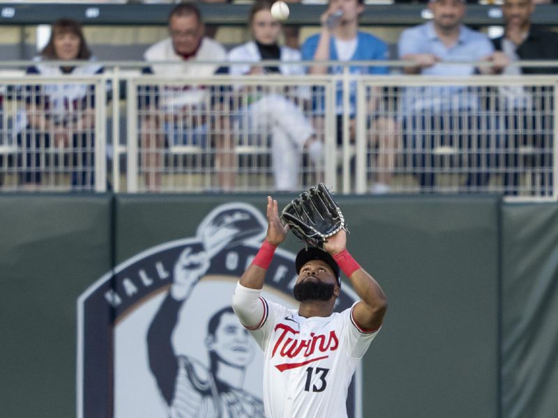 May 8, 2024; Minneapolis, Minnesota, USA; Minnesota Twins left fielder Manuel Margot (13) catches a fly ball against the Seattle Mariners in the fifth inning at Target Field. Mandatory Credit: Jesse Johnson-USA TODAY Sports