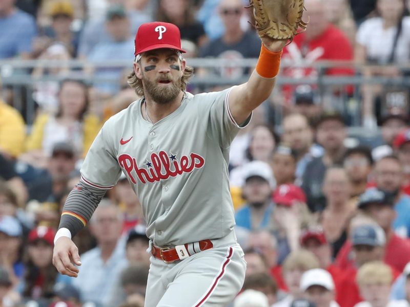 Jul 20, 2024; Pittsburgh, Pennsylvania, USA;  Philadelphia Phillies first baseman Bryce Harper (3) takes a throw at first base to record an out against the Pittsburgh Pirates during the fifth inning at PNC Park. The Pirates won 4-1. Mandatory Credit: Charles LeClaire-USA TODAY Sports