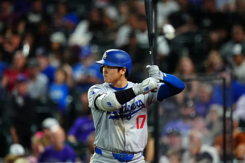 Sep 28, 2024; Denver, Colorado, USA; Los Angeles Dodgers designated hitter Shohei Ohtani (17) on deck in the ninth inning against the Colorado Rockies at Coors Field. Mandatory Credit: Ron Chenoy-Imagn Images