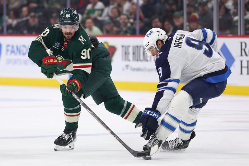 Jan 15, 2026; Saint Paul, Minnesota, USA; Minnesota Wild left wing Marcus Johansson (90) shoots as Winnipeg Jets left wing Alex Iafallo (9) defends during the first period at Grand Casino Arena. Mandatory Credit: Matt Krohn-Imagn Images