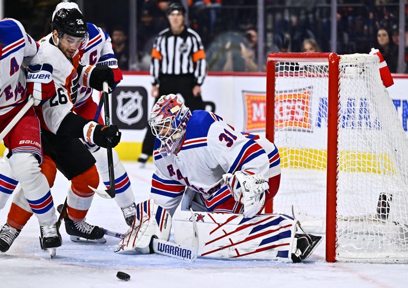 Feb 24, 2024; Philadelphia, Pennsylvania, USA; New York Rangers goalie Igor Shesterkin (31) defends the net as Philadelphia Flyers defenseman Sean Walker (26) chases the puck in the first period at Wells Fargo Center. Mandatory Credit: Kyle Ross-USA TODAY Sports