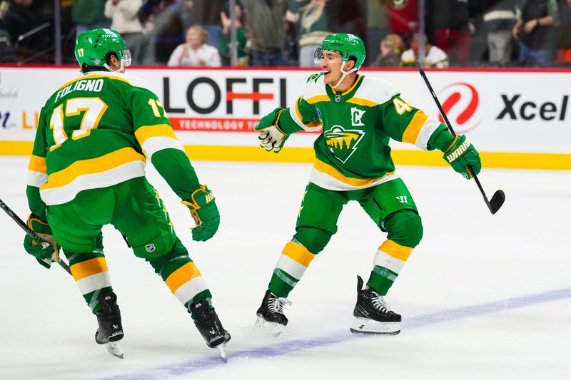 Nov 3, 2024; Saint Paul, Minnesota, USA; Minnesota Wild defenseman Jared Spurgeon (46) celebrates with left wing Marcus Foligno (17) following the game against the Toronto Maple Leafs at Xcel Energy Center. Mandatory Credit: Brace Hemmelgarn-Imagn Images