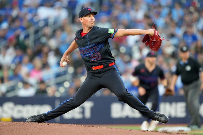 Aug 23, 2024; Toronto, Ontario, CAN; Toronto Blue Jays starting pitcher Chris Bassitt (40) pitches to the Los Angeles Angels during the second inning at Rogers Centre. Mandatory Credit: John E. Sokolowski-USA TODAY Sports