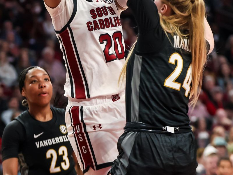 Jan 28, 2024; Columbia, South Carolina, USA; South Carolina Gamecocks forward Sania Feagin (20) shoots over Vanderbilt Commodores guard Aga Makurat (24) in the second half at Colonial Life Arena. Mandatory Credit: Jeff Blake-USA TODAY Sports