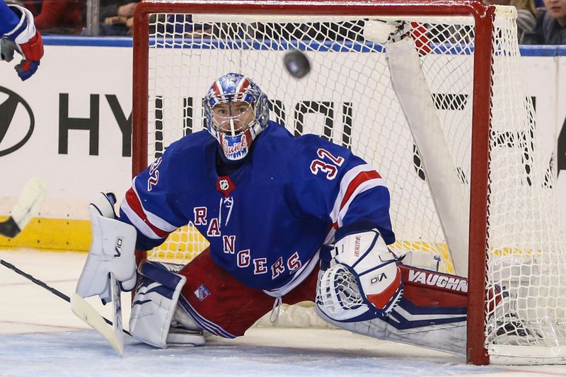 Nov 12, 2023; New York, New York, USA;  New York Rangers goaltender Jonathan Quick (32) watches the puck in the second period against the Columbus Blue Jackets at Madison Square Garden. Mandatory Credit: Wendell Cruz-USA TODAY Sports