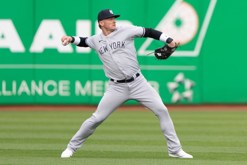 Jun 28, 2023; Oakland, California, USA;  New York Yankees third baseman Josh Donaldson (28) throws the ball during warmups before the start of the first inning against the Oakland Athletics at Oakland-Alameda County Coliseum. Mandatory Credit: Stan Szeto-USA TODAY Sports