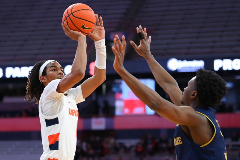 Jan 14, 2023; Syracuse, New York, USA; Syracuse Orange forward Chris Bell (0) shoots the ball as Notre Dame Fighting Irish guard Trey Wertz (3) defends during the first half  at the JMA Wireless Dome. Mandatory Credit: Rich Barnes-USA TODAY Sports