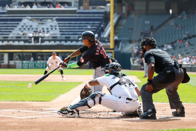 Sep 11, 2024; Chicago, Illinois, USA; Cleveland Guardians third baseman Jose Ramirez (11) singles against the Cleveland Guardians during the first inning at Guaranteed Rate Field. Mandatory Credit: Kamil Krzaczynski-Imagn Images