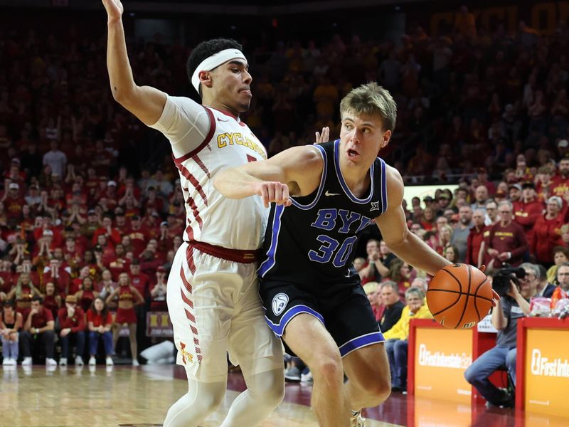 Mar 6, 2024; Ames, Iowa, USA; Iowa State Cyclones guard Tamin Lipsey (3) defends Brigham Young Cougars guard Dallin Hall (30) in the second half at James H. Hilton Coliseum. Mandatory Credit: Reese Strickland-USA TODAY Sports

