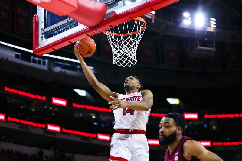 Feb 1, 2023; Raleigh, North Carolina, USA; North Carolina State Wolfpack guard Casey Morsell (14) goes for a shot during the first half against Florida State at PNC Arena.  Mandatory Credit: Jaylynn Nash-USA TODAY Sports