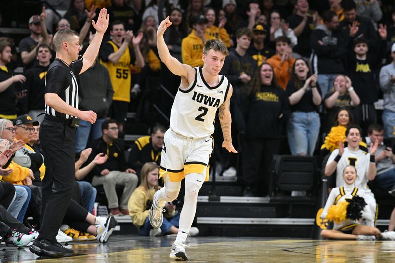 Feb 27, 2024; Iowa City, Iowa, USA; Iowa Hawkeyes guard Brock Harding (2) reacts during the first half after making a three point basket against the Penn State Nittany Lions at Carver-Hawkeye Arena. Mandatory Credit: Jeffrey Becker-USA TODAY Sports