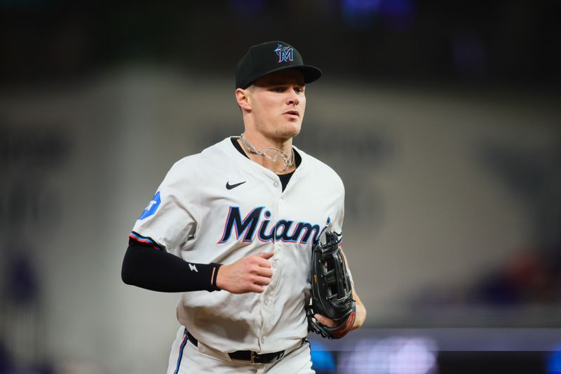 Sep 19, 2024; Miami, Florida, USA; Miami Marlins right fielder Griffin Conine (56) runs toward the dugout against the Los Angeles Dodgers during the fifth inning at loanDepot Park. Mandatory Credit: Sam Navarro-Imagn Images