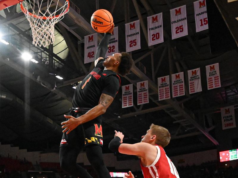 Jan 25, 2023; College Park, Maryland, USA;  Maryland Terrapins guard Jahmir Young (1) dunks over Wisconsin Badgers guard Isaac Lindsey (10) during the second half at Xfinity Center. Mandatory Credit: Tommy Gilligan-USA TODAY Sports