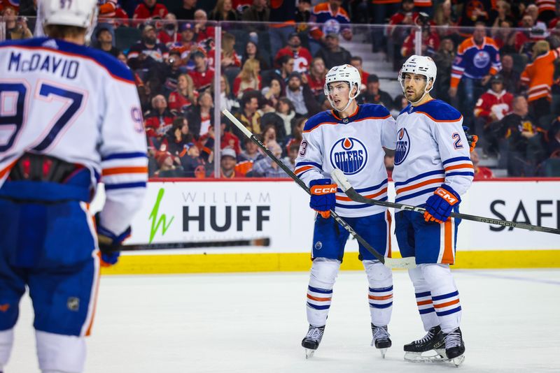 Apr 6, 2024; Calgary, Alberta, CAN; Edmonton Oilers defenseman Evan Bouchard (2) celebrates his goal with teammates against the Calgary Flames during the third period at Scotiabank Saddledome. Mandatory Credit: Sergei Belski-USA TODAY Sports