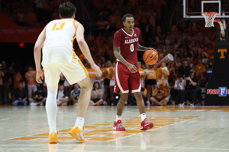 Feb 28, 2026; Knoxville, Tennessee, USA;  Alabama Crimson Tide guard Labaron Philon (0) brings the ball up court against Tennessee Volunteers forward J.P. Estrella (13) during the second half at Thompson-Boling Arena at Food City Center. Mandatory Credit: Randy Sartin-Imagn Images