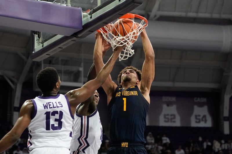 Jan 31, 2023; Fort Worth, Texas, USA; West Virginia Mountaineers forward Emmitt Matthews Jr. (1) dunks the ball against TCU Horned Frogs guard Damion Baugh (10) and guard Shahada Wells (13) during the second half at Ed and Rae Schollmaier Arena. Mandatory Credit: Chris Jones-USA TODAY Sports