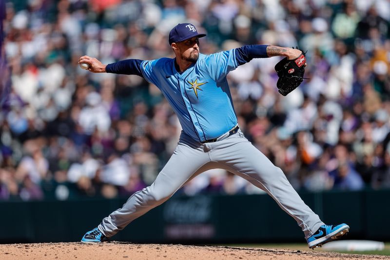 Apr 7, 2024; Denver, Colorado, USA; Tampa Bay Rays relief pitcher Shawn Armstrong (64) pitches in the eighth inning against the Colorado Rockies at Coors Field. Mandatory Credit: Isaiah J. Downing-USA TODAY Sports