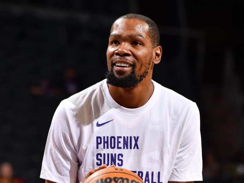 PHOENIX, AZ - MARCH 21:  Kevin Durant #35 of the Phoenix Suns warms-up before the game on March 21, 2024 at Footprint Center in Phoenix, Arizona. NOTE TO USER: User expressly acknowledges and agrees that, by downloading and or using this photograph, user is consenting to the terms and conditions of the Getty Images License Agreement. Mandatory Copyright Notice: Copyright 2024 NBAE (Photo by Barry Gossage/NBAE via Getty Images)