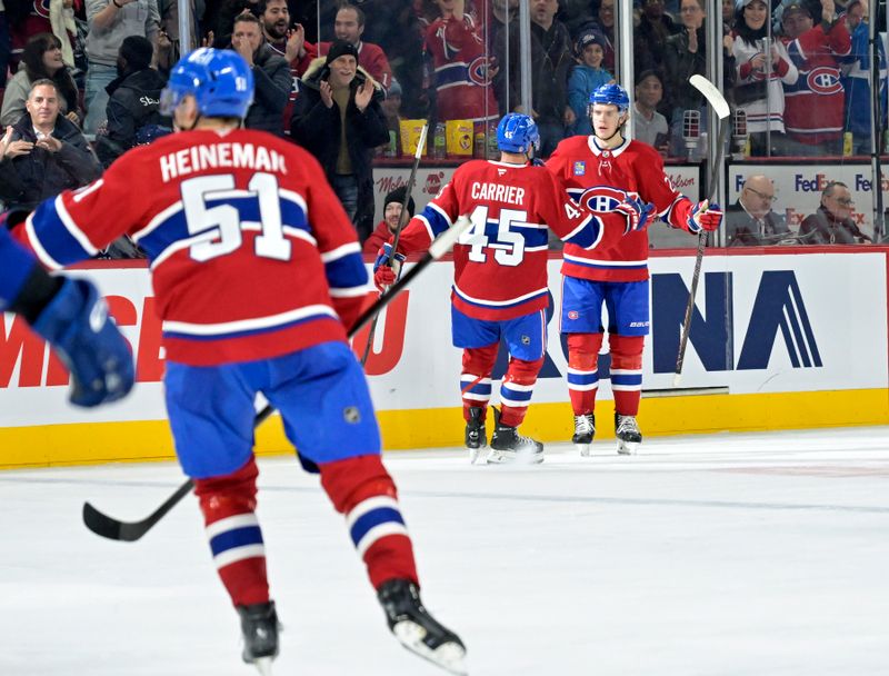 Jan 6, 2025; Montreal, Quebec, CAN; Montreal Canadiens defenseman Kaiden Guhle (21) celebrates with teammates after scoring a goal against the Vancouver Canucks during the second period at the Bell Centre. Mandatory Credit: Eric Bolte-Imagn Images