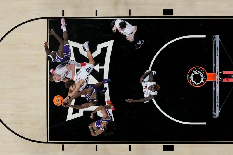 sJan 16, 2024; Cincinnati, Ohio, USA;  The Cincinnati Bearcats and the TCU Horned Frogs battle for a rebound in the second half at Fifth Third Arena. Mandatory Credit: Aaron Doster-USA TODAY Sports