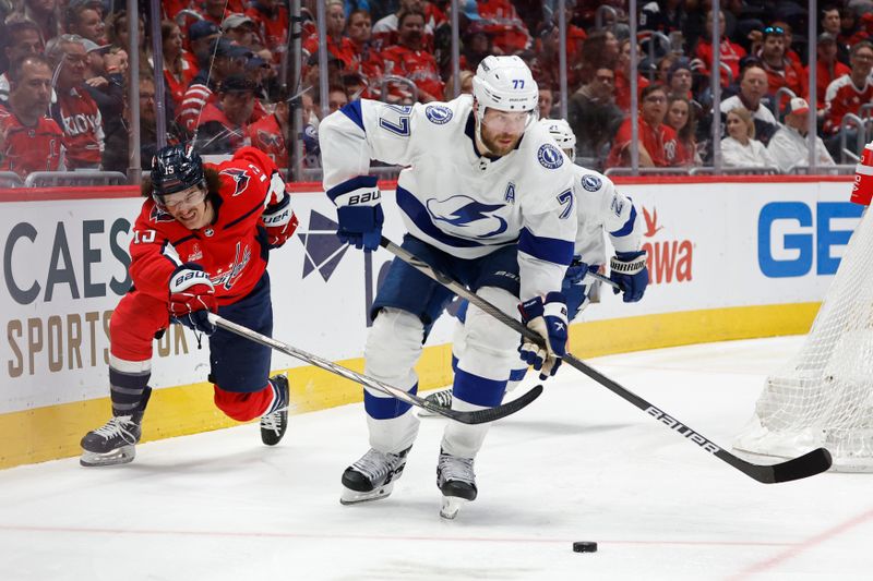 Apr 13, 2024; Washington, District of Columbia, USA; Tampa Bay Lightning defenseman Victor Hedman (77) skates with the puck as Washington Capitals left wing Sonny Milano (15) chases in the third period at Capital One Arena. Mandatory Credit: Geoff Burke-USA TODAY Sports