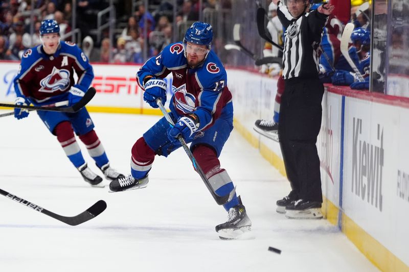 Apr 8, 2025; Denver, Colorado, USA; Colorado Avalanche right wing Valeri Nichushkin (13) passes the puck in the second period against the Vegas Golden Knights at Ball Arena. Mandatory Credit: Ron Chenoy-Imagn Images