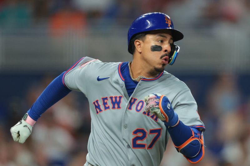 Sep 28, 2025; Miami, Florida, USA; New York Mets designated hitter Mark Vientos (27) runs toward first base after hitting a single against the Miami Marlins during the sixth inning at loanDepot Park. Mandatory Credit: Sam Navarro-Imagn Images