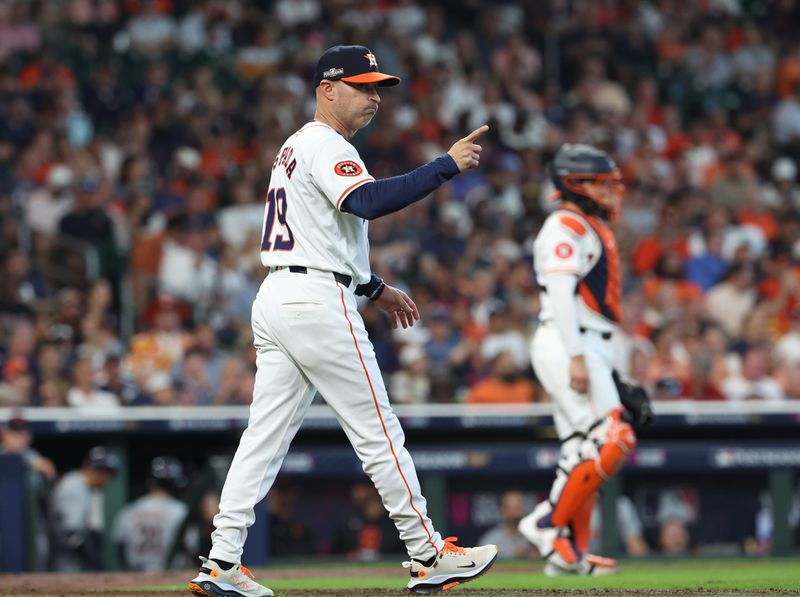 Oct 1, 2024; Houston, Texas, USA; Houston Astros manager Joe Espada (19) makes a pitching change against the Detroit Tigers in the fifth inning in game one of the Wild Card round for the 2024 MLB Playoffs at Minute Maid Park. Mandatory Credit: Troy Taormina-Imagn Images