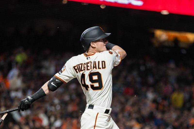 Sep 27, 2023; San Francisco, California, USA;  San Francisco Giants center fielder Tyler Fitzgerald (49) hits and RBI single against the San Diego Padres during the fifth inning at Oracle Park. Mandatory Credit: John Hefti-USA TODAY Sports