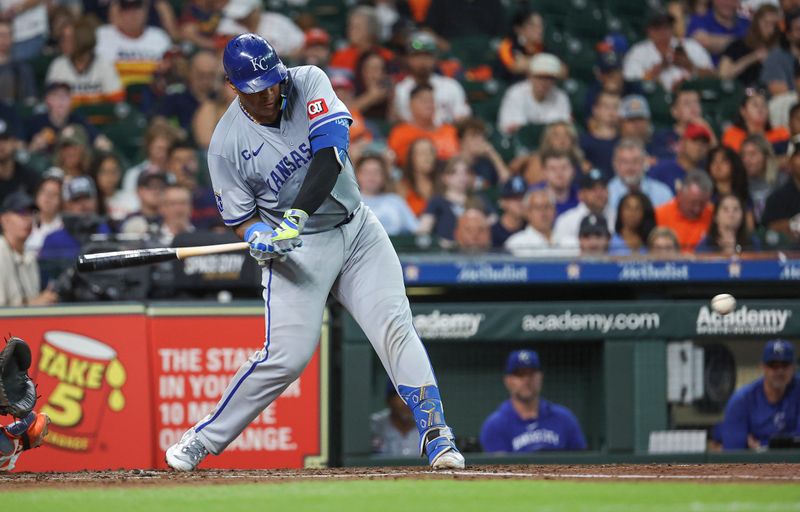 Aug 31, 2024; Houston, Texas, USA; Kansas City Royals catcher Salvador Perez (13) hits a single during the fourth inning against the Houston Astros at Minute Maid Park. Mandatory Credit: Troy Taormina-USA TODAY Sports