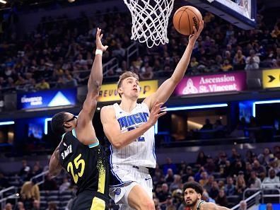 INDIANAPOLIS, INDIANA - DECEMBER 23: Franz Wagner #22 of the Orlando Magic takes a shot over Jalen Smith #25 of the Indiana Pacers during the first half at Gainbridge Fieldhouse on December 23, 2023 in Indianapolis, Indiana. NOTE TO USER: User expressly acknowledges and agrees that, by downloading and or using this photograph, User is consenting to the terms and conditions of the Getty Images License Agreement. (Photo by Justin Casterline/Getty Images)