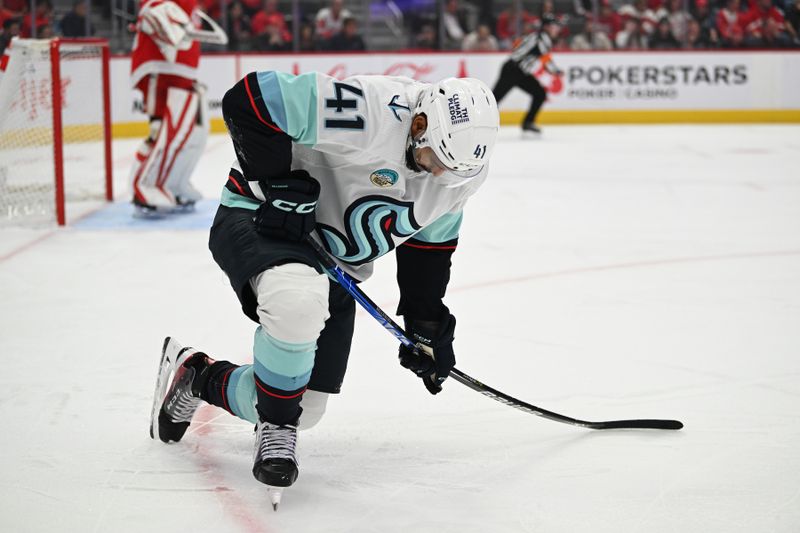 Oct 24, 2023; Detroit, Michigan, USA; Seattle Kraken left wing Pierre-Edouard Bellemare (41) struggles to get off the ice after being injured against the Detroit Red Wings in the first period at Little Caesars Arena. Mandatory Credit: Lon Horwedel-USA TODAY Sports