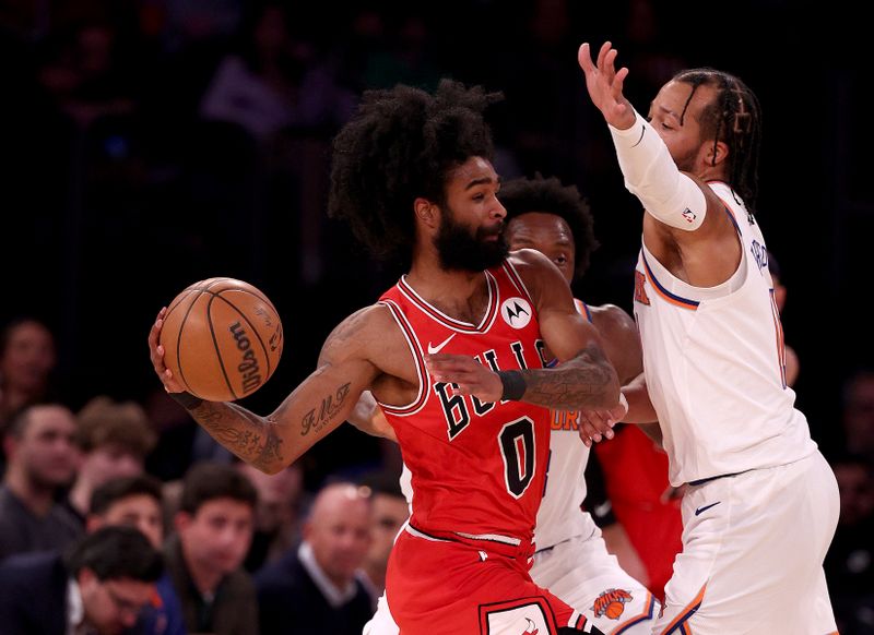 NEW YORK, NEW YORK - JANUARY 03: Coby White #0 of the Chicago Bulls tries to pass as Jalen Brunson #11 of the New York Knicks defends during the first half at Madison Square Garden on January 03, 2024 in New York City. NOTE TO USER: User expressly acknowledges and agrees that, by downloading and or using this photograph, User is consenting to the terms and conditions of the Getty Images License Agreement. (Photo by Elsa/Getty Images)