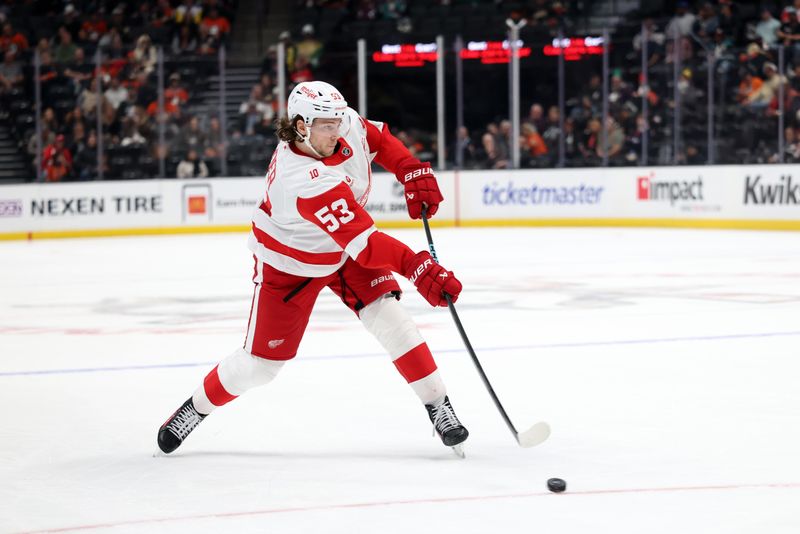 Oct 31, 2025; Anaheim, California, USA;  Detroit Red Wings defenseman Moritz Seider (53) takes a slapshot during the third period against the Anaheim Ducks at Honda Center. Mandatory Credit: Kiyoshi Mio-Imagn Images