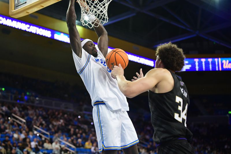 January 14, 2024; Los Angeles, California, USA; UCLA Bruins forward Adem Bona (3) dunks for the basket against Washington Huskies center Braxton Meah (34) during the second half at Pauley Pavilion. Mandatory Credit: Gary A. Vasquez-USA TODAY Sports